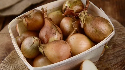 Portion of raw Onions (4K, seamless loopable) Stock Footage