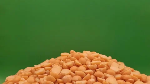 Portion of raw split peas on a green background. Stock Footage 290869047