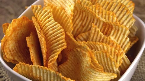 Portion of rippled Potato Chips (not loopable) Stock Footage