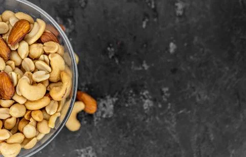 Portion of roasted nuts (close up; selective focus) Stock Photos