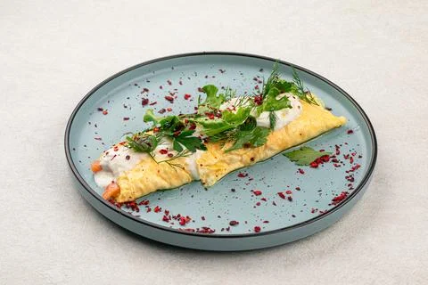 Portion of rolled omelette with salmon Stock Photos