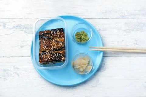 Portion of rolls with eel with wasabi and ginger Stock Photos