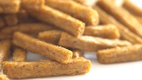 Portion of rotating Bread Chips as seamless loopable 4K UHD footage Video stock 88474720