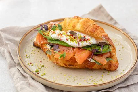 Portion of salmon croissant sandwich Stock Photos