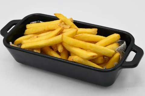 Portion of salty fried potatoes Stock Photos