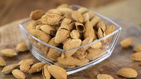 Portion of shelled, roasted Almonds (seamless loopable, 4K) Stock Footage 83847794