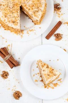 Portion of sliced easter carrot sponge cake on white table Stock Photos
