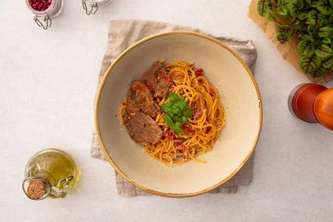 Portion of spaghetti pasta with roast beef Stock Photos