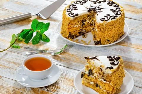 Portion of sponge prune cake decorated with chocolate glaze Stock Photos
