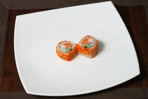 Portion sushi on a large square white plate Stock Photos