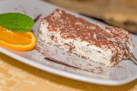 A portion of tiramisu cake Stock Photos