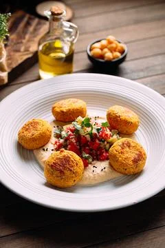 Portion of vegetarian falafels with hummus Stock Photos