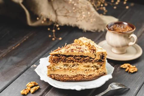 A Portion of Walnut Cake Served on the Plate Stock Photos