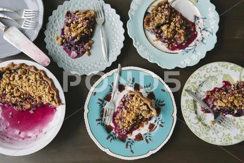Portions of blueberry pie on plates Stock Photos