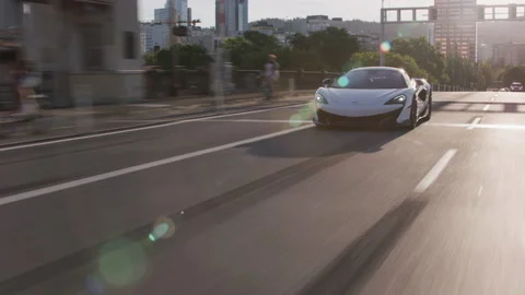 Portland, Oregon circa-2020:  McLaren exotic sports car driving on street Stock Footage