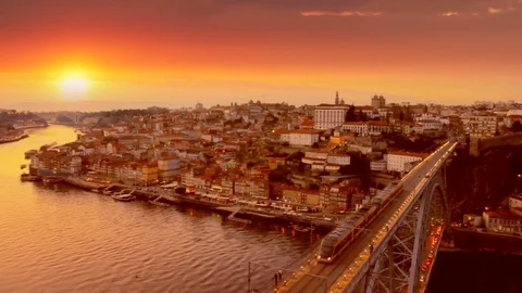 Porto old town skyline on the Douro River at sunset, Portugal Stock Footage