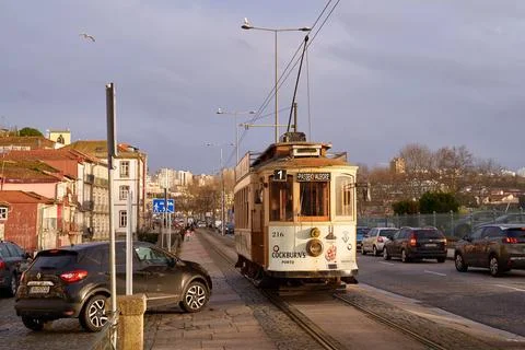 Porto, Portugal. Traditional vintage tram passes through the historical Linha 1 Stock Photos