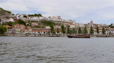 Porto View over Douro River, traditional Rabelo boat and Gaia waterfront Stock Footage 52085524