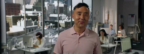 Portrait of 30s male worker is posing to the camera, busy office Stock Footage 254691682