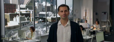 Portrait of 30s male worker is posing to the camera, busy office Stock Footage 254692324