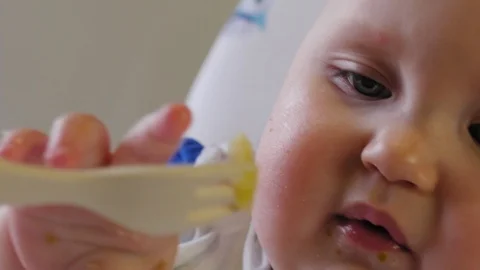 Portrait of 9 month old chubby baby in the kitchen. Stock Footage 129691137