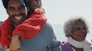 Portrait Of Active Multi-Generation Family On Winter Beach Vacation Stock Footage
