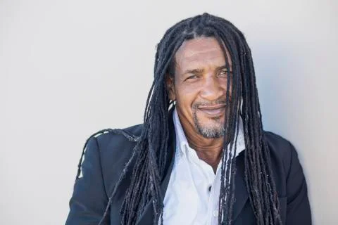 Portrait of adult strong black men with long dreadlocks and blue eyes. Stock Photos