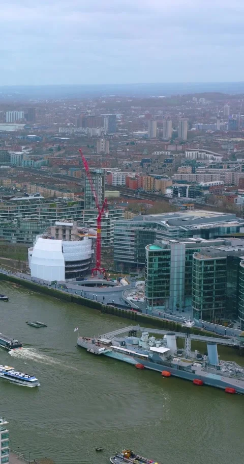 Portrait Aerial View of Tower Bridge and London Waterfront Stock Footage 337906887