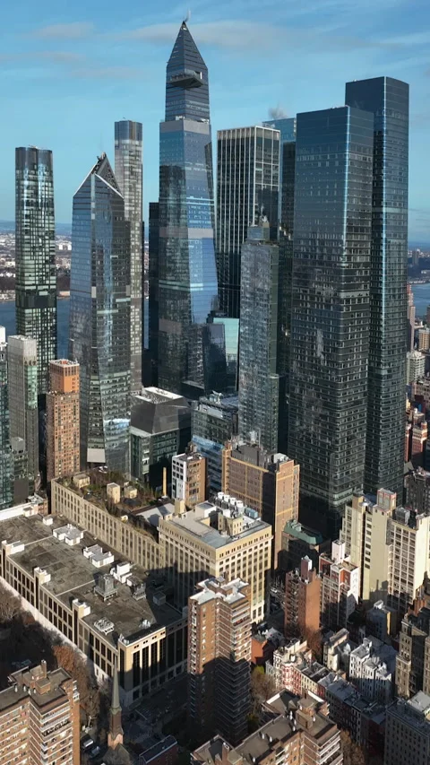 Portrait aerial view of towering high-rise of Hudson Yards, sunny day in NYC Видео 332824902