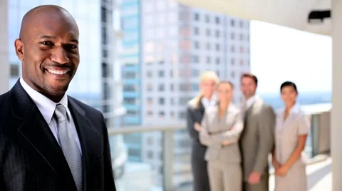 Portrait of African American Businessman with Colleagues Stock Footage