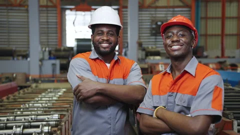 Portrait African engineer and worker industry wear a uniform in the factory. Stock Footage 173375788