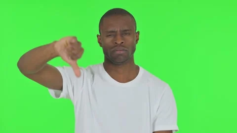 Portrait of African Man with Thumbs Down on Green Background Stock-Footage 295160902
