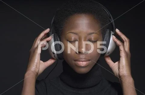 Portrait Of African Woman Wearing Headphones