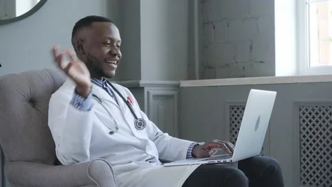 Portrait of afro american doctor using laptop computer. online consultation Stock Footage 134310059