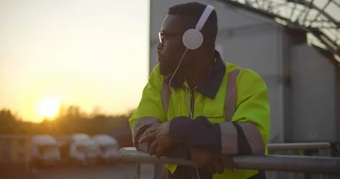 Portrait of afro constructor in headphones Video stock 114332032