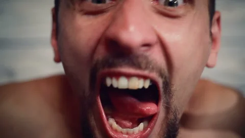 Portrait of an aggressive maniac with an axe Stock Footage 146655692