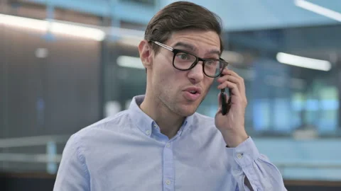 Portrait of Aggressive Young Man Angry on Smartphone Stock Footage 150641795