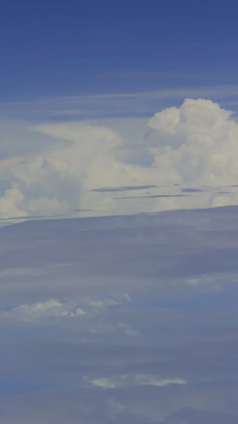 Portrait Airplane Window View of Blue Sky Stock Footage 337376913