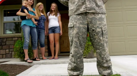 Portrait of American soldier with family in background Stock Footage