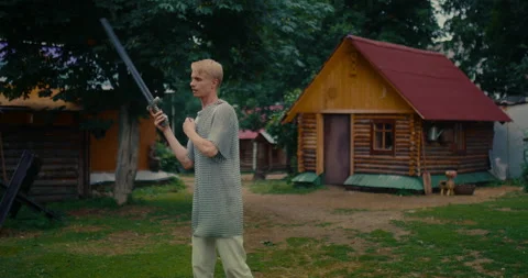 Portrait of ancient warrior with sword, practicing to fight, historical Stock Footage 252120998