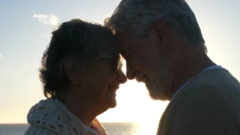 Portrait and close up of two happy in love seniors looking to each other smiling Stock Footage 151333229