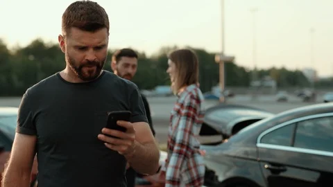 Portrait of angry baffled man with beard tapping on smartphone. Emotional male Stock Footage 112988385