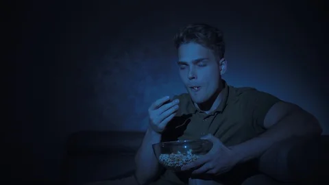 Portrait of an angry handsome young guy watching television Stock Footage 116175371