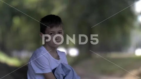 Portrait of angry kid looking directly camera, child with serious expressive Stock Photos