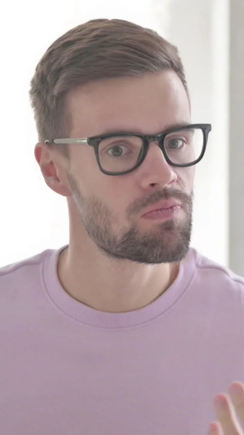 Portrait of Angry Young Man Arguing in Frustration, Vertical Video Video stock 328972074