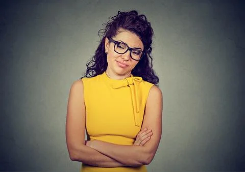 Portrait of an annoyed grumpy looking young woman Stock Photos
