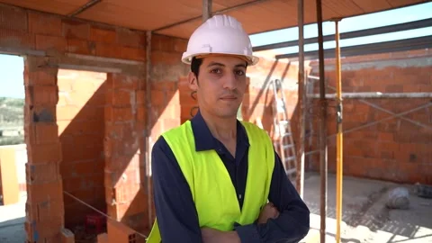 Portrait of an Arab male worker inside a construction site. With arms cross.. Stock Footage 242005154