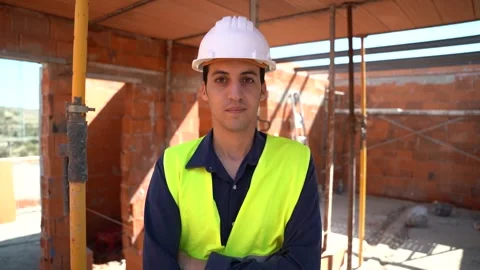Portrait of an Arab male worker inside a construction site. He is looking a.. Stock Footage 242036438