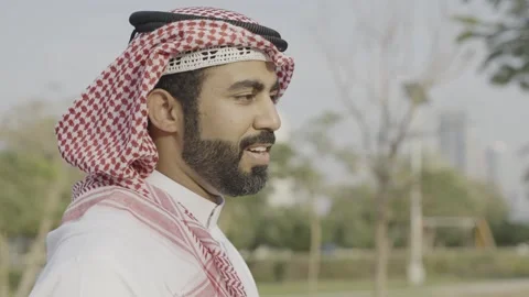 Portrait of an arab man talking in the park. Stock Footage 303638306