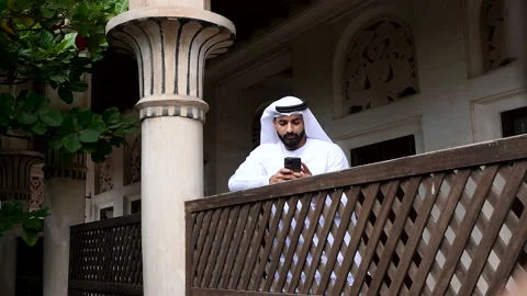 Portrait of an arab man texting on his mobile. Stock Footage 232641656